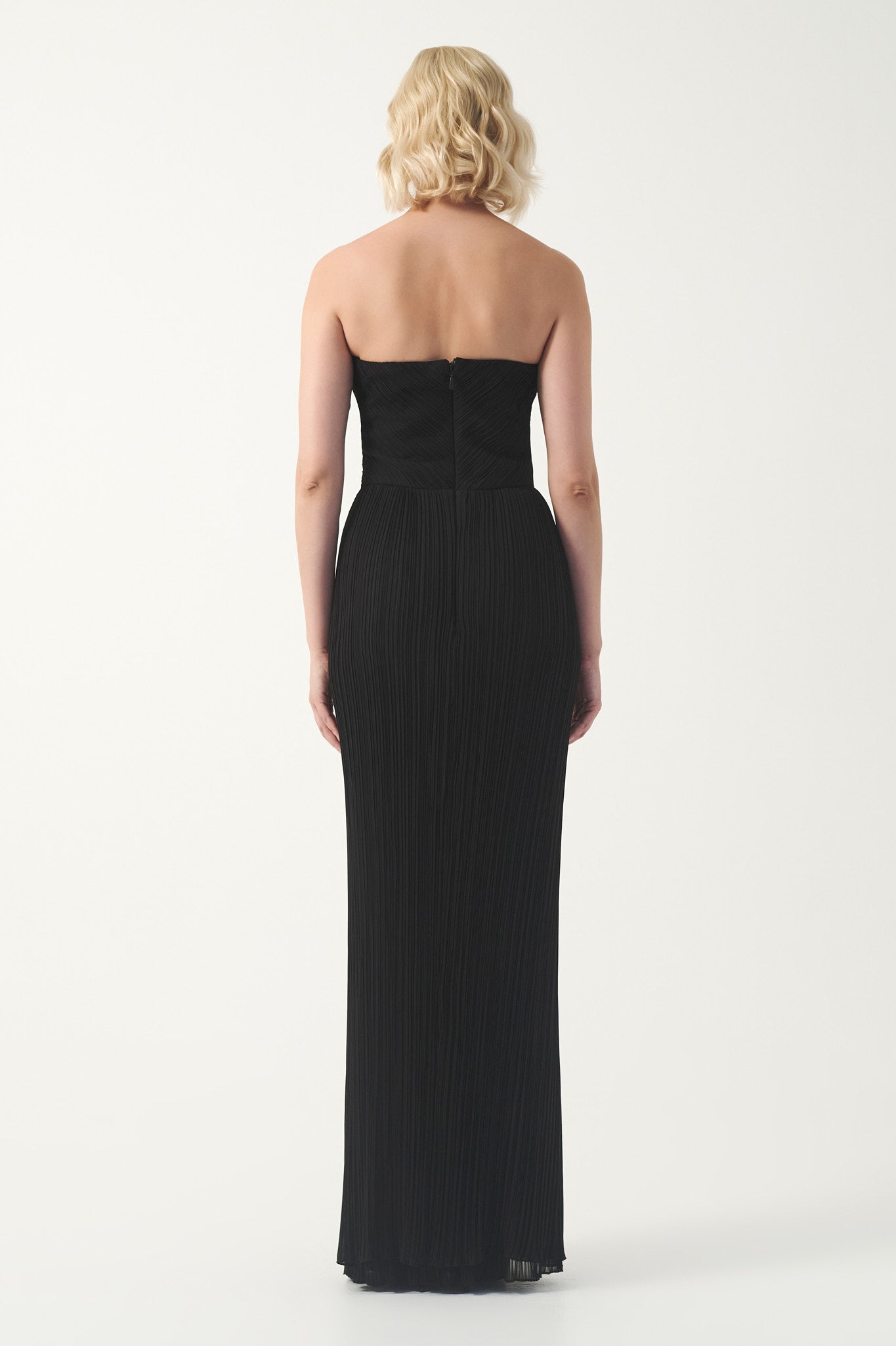 Strapless pleated gown with wrapped bodice